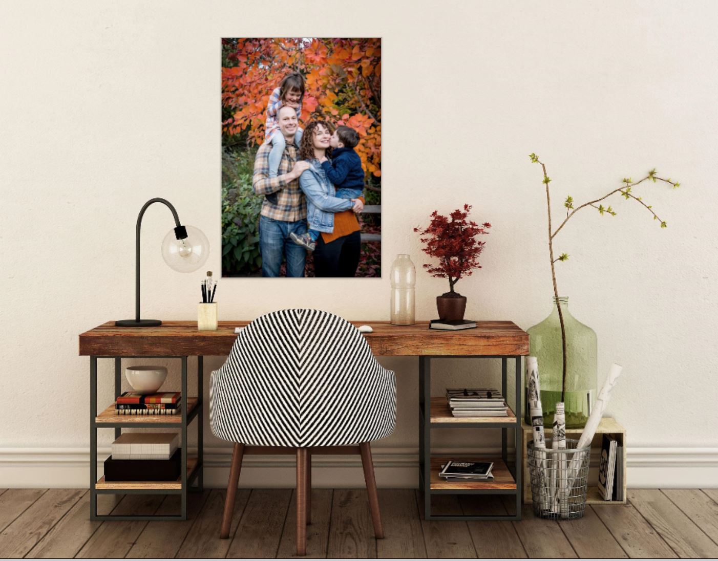 Outdoor family portrait in fall with parents holding two young children.