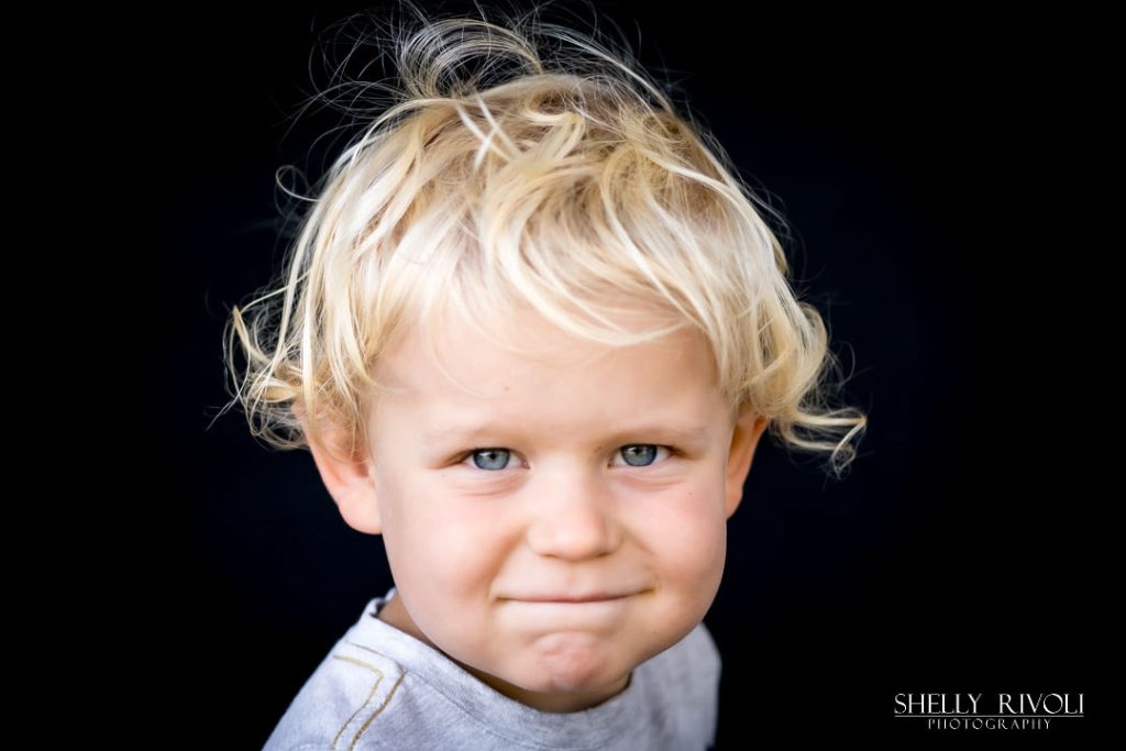 authentic kids portrait of young blond toddler by Bay Area portrait photographer Shelly Rivoli