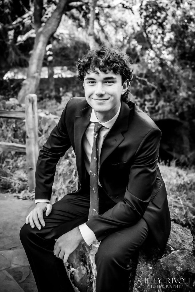 BW outdoor Bay Area senior portrait of teen boy in suit by photographer Shelly Rivoli