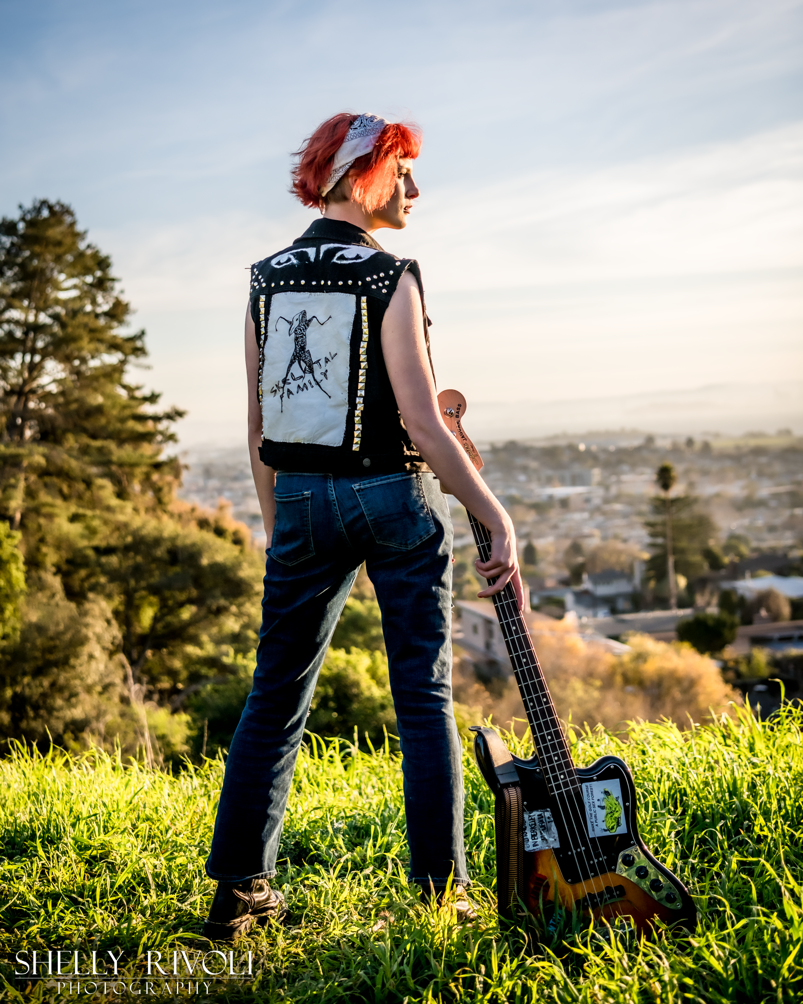 Outdoor senior portrait of young musician overlooking San Francisco Bay