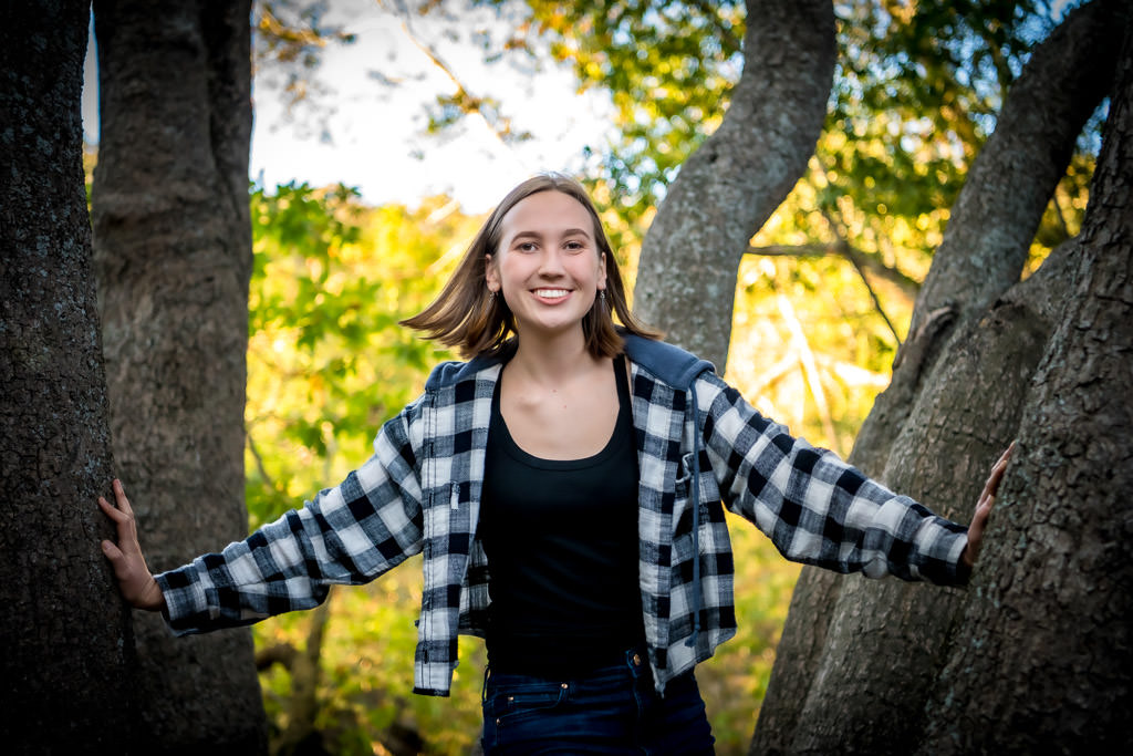 Bay Area senior portrait outdoors in a tree by photographer Shelly Rivoli
