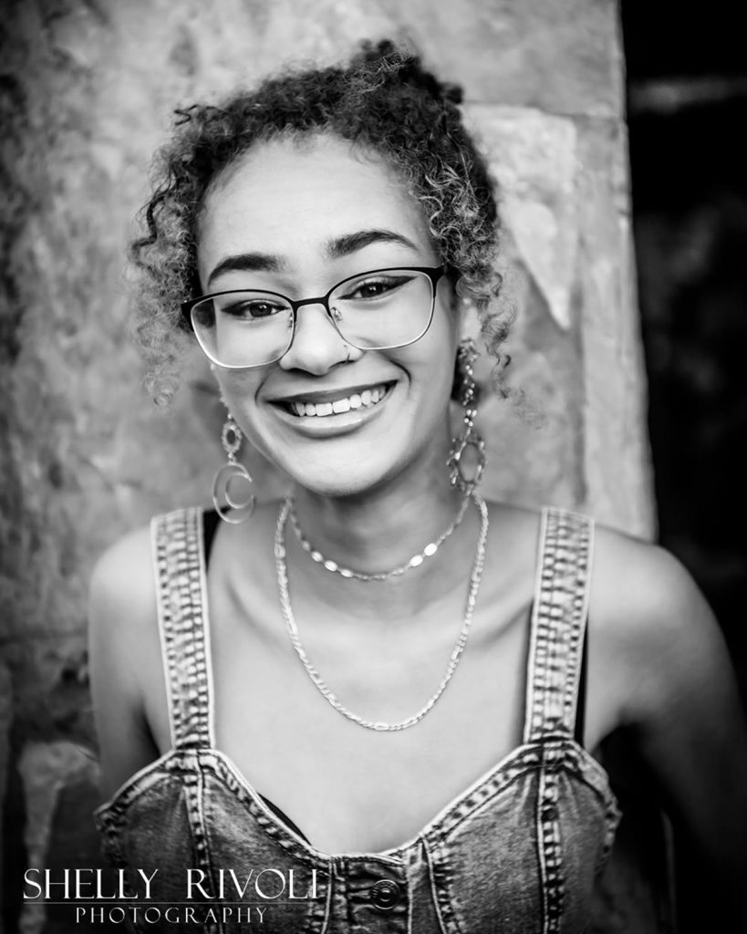 BW Bay Area senior portrait outdoor of smiling teen girl in glasses by photographer Shelly Rivoli
