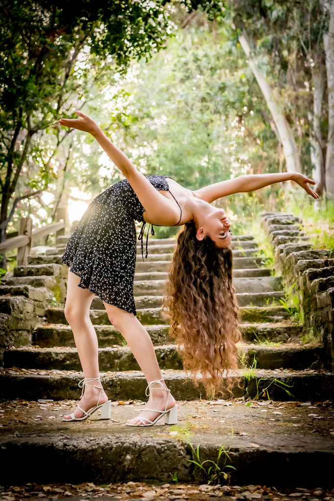 Bay Area senior portrait of young woman in dance pose outdoors by photographer Shelly Rivoli