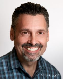 East Bay headshot with white background of man wearing business casual by Shelly Rivoli Photography