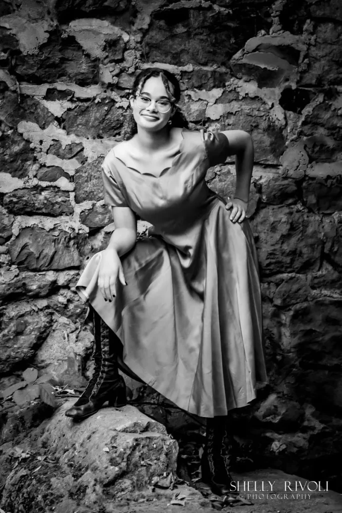 BW outdoor senior portrait of young woman in vintage dress
